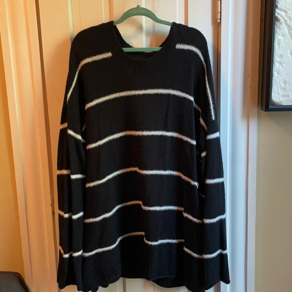 Oversized fuzzy sweater. Black with white strips.